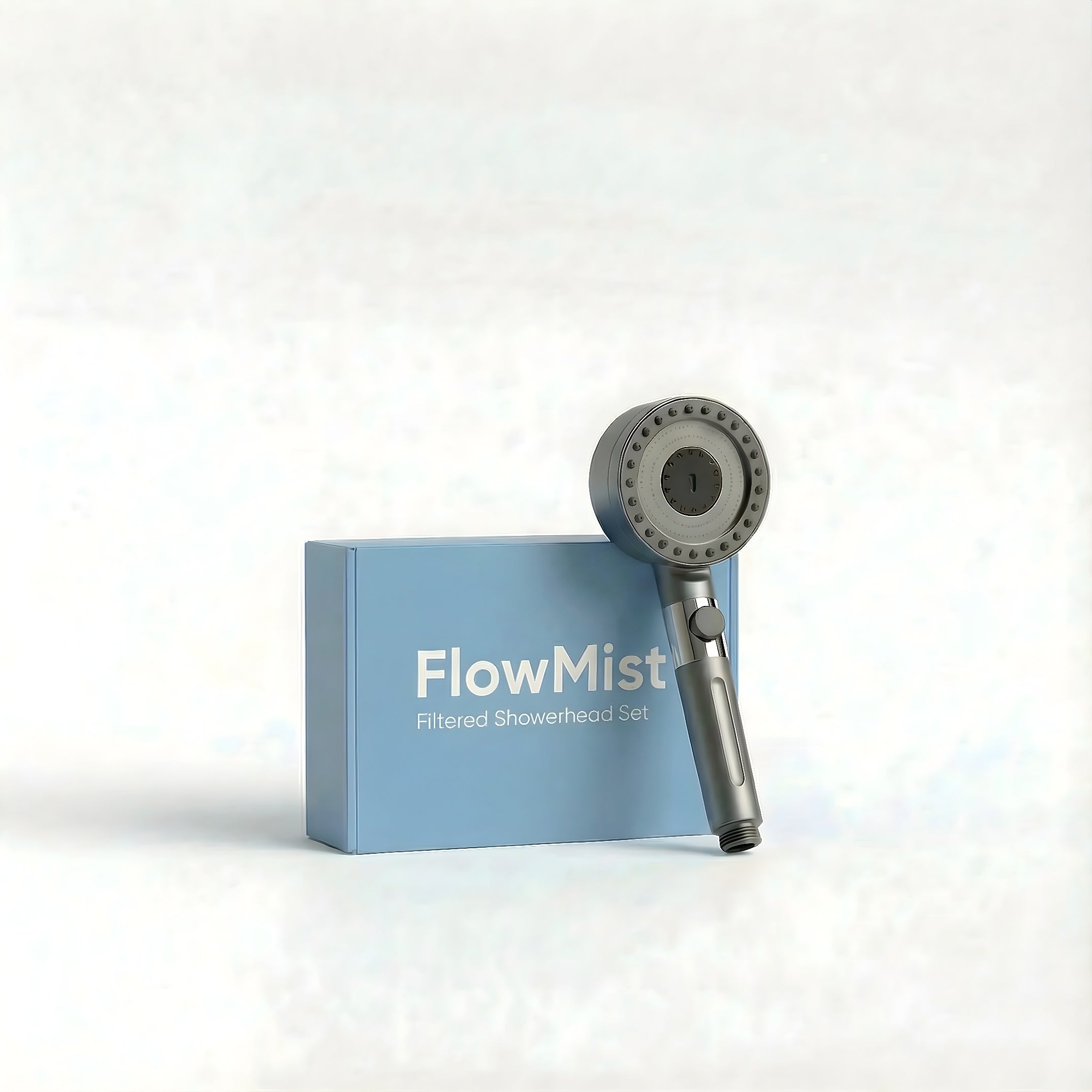 FlowMist filtered showerhead set featuring the showerhead, hose, wall mount, and 5 filters. The product is elegantly displayed with the sleek, modern design on a minimalist light-colored background.